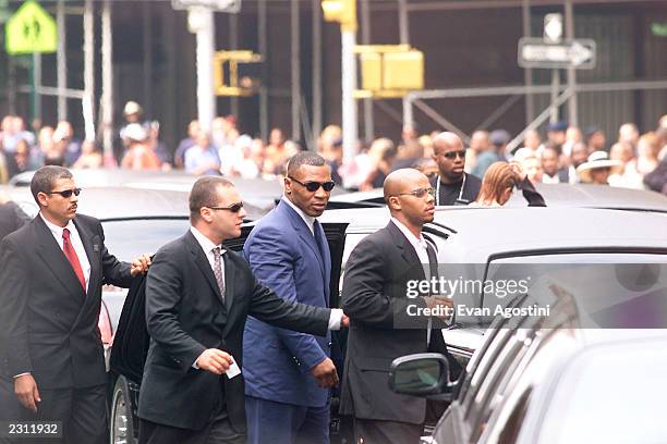 Mike Tyson arrives at R&B singer Aaliyah's funeral at St. Ignatius Loyola Roman Catholic Church in New York City. 8/31/2001. Photo: Evan...