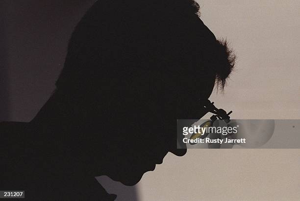 Silhouette of Ralf Schumann of Germany during the mens 25m rapid pistol event at the Wold Creek Complexr at the 1996 Centennial Olympic Games in...
