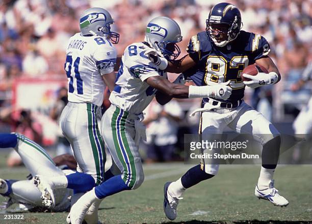 SEATTLE SEAHAWKS WIDE RECEIVERS RONNIE HARRIS AND JAMES MCKNIGHT ATTEMPT TO TACKLE SAN DIEGO CHARGERS WIDE RECEIVER ANDRE COLEMAN ON A PUNT RETURN...