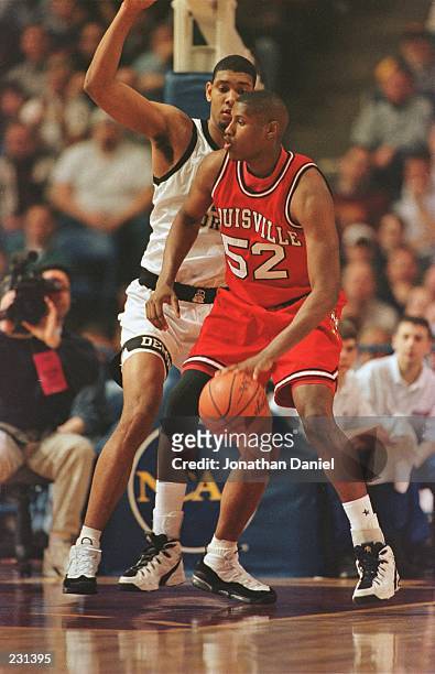 Forward Samaki Walker of Louisville University posts up Tim Duncan of Wake Forest during the Cardinals 60-59 loss to Wake Forest a the Metrodome in...