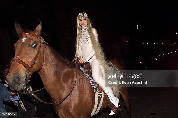 Model Heidi Klum arrives on horseback as Lady Godiva at her Annual Halloween Party at Lot 61 in New York City. . Photo: Evan Agostini/Getty Images