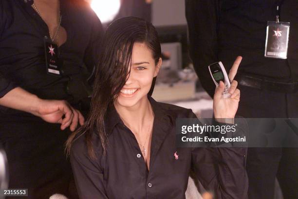 Adriana Lima backstage in hair and make-up before the Victoria's Secret Fashion Show 2001 at Bryant Park in New York City. . Photo: Evan...