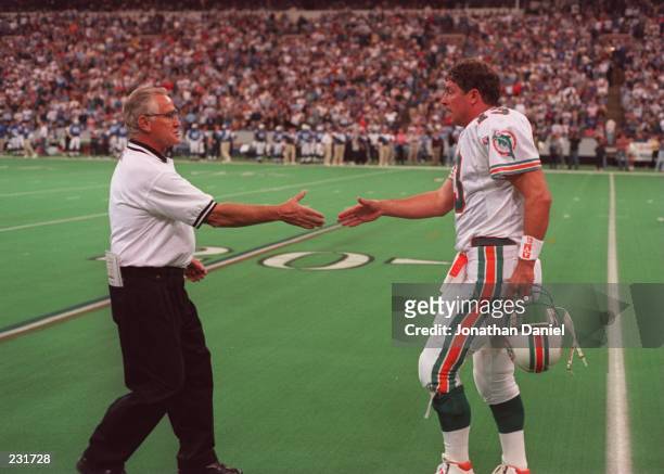 Head coach Don Shula congratulates quarterback Dan Marino of the Miami Dolphins during the Dolphins 36-28 loss to the Baltimore Colts at the RCA Dome...
