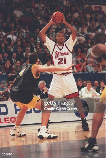 Center Marcus Camby of the University of Massachusetts looks to pass the ball during the Minutemen 92-70 win over Central Florida at Providence Civic...