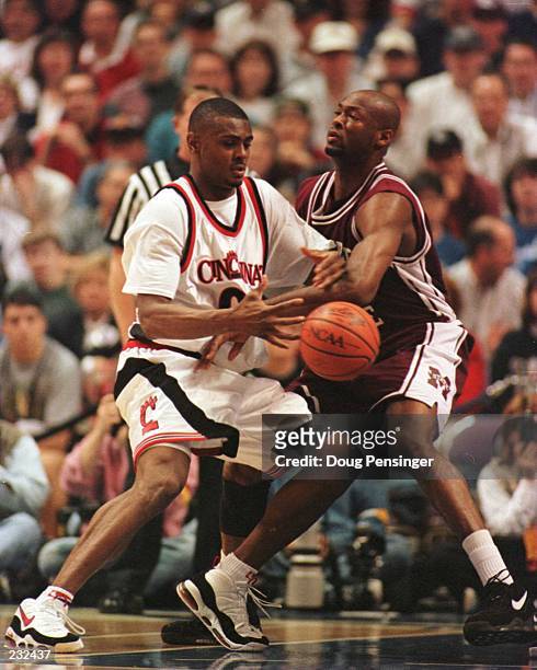 Art Long of Cincinnati and Erick Dampier of Mississippi State struggle for the ball in the first half play of the NCAA South East Regional Finals at...