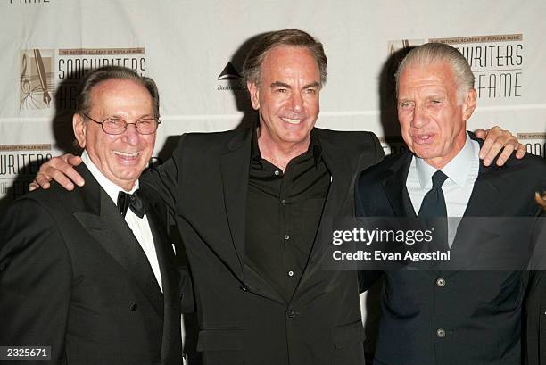 Hal David, Chairman/CEO Songwriters Hall of Fame, Neil Diamond and Stephen Swid, Chairman/CEO of SCS Communications and SESAC, who was given the...