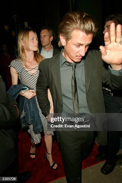 Sean Penn and wife Robin Wright Penn leaving the "Man Ray" restaurant & bar first anniversary party in New York City. July 10, 2002. Photo: Evan...