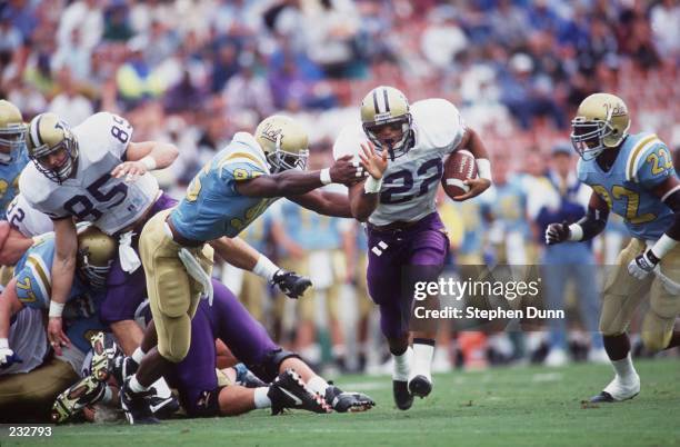 UNIVERSITY OF WASHINGTON RUNNING BACK MATT JONES BREAKS THE TACKLE OF UCLA LINEBACKER JAMIR MILLER DURING THE HUSKIES 39-25 LOSS TO THE BRUINS.