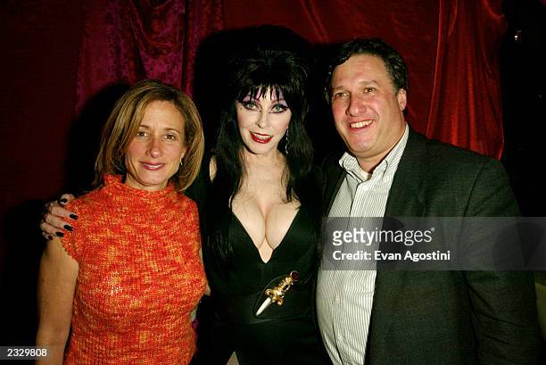 Elvira with Lynn Hamlin, Pres. Goodtimes Direct, and her fiance at a pre-screening party for "Elvira's Haunted Hills" at Lucky Cheng's in New York...