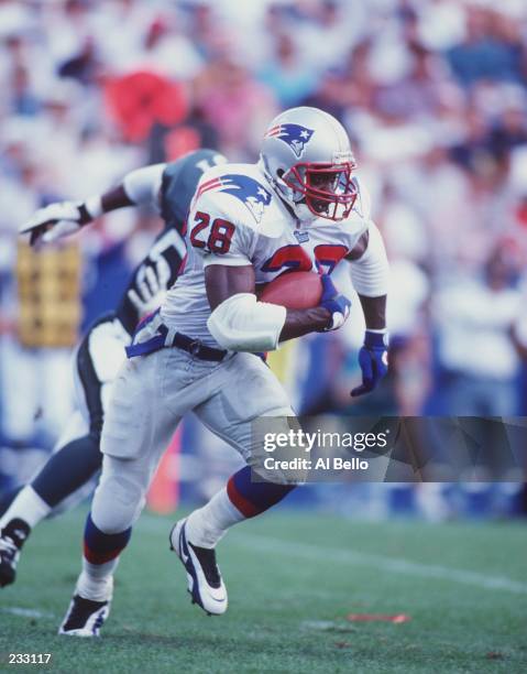 Running back Curtis Martin of the New England Patriots carries the football during a 37-10 win over the Philadelphia Eagles at Foxboro Stadium in...