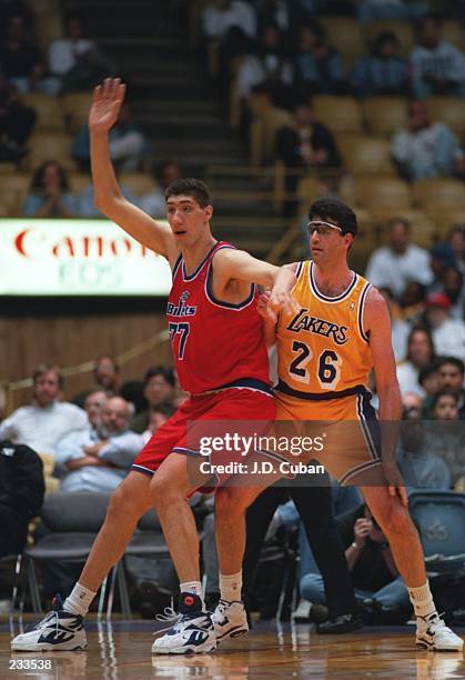 Center Gheorghe Muresan of the Washington Bullets posts up during the Bullets versus Los Angeles Lakers game at the Great Western Forum in Inglewood,...