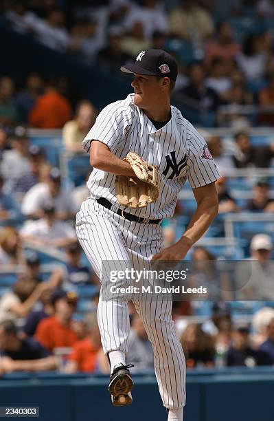 Former New York Yankee Jim Abbott pitches during the club's 57th Annual Old Timers' Day festivities before the game between the Cleveland Indians and...