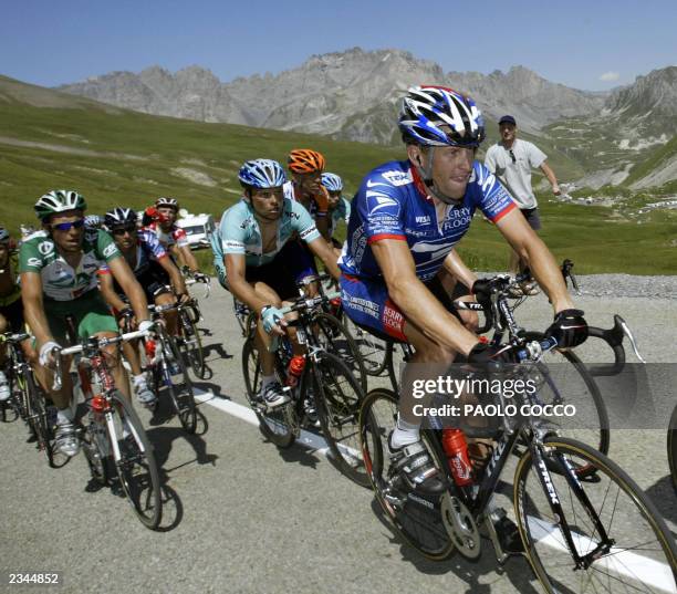Postal leader Lance Armstrong rides in front of German Jan Ullrich and Frenchman Christophe Moreau during the eighth stage of the 90th Tour de France...