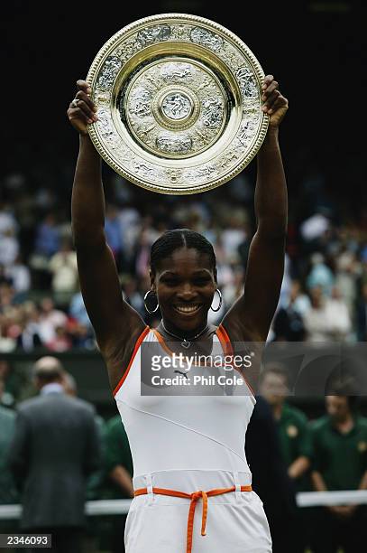 Serena Williams of the USA lifts the trophy high up in the air after her victory over sister Venus Williams of the USA in the Womens Singles Final...