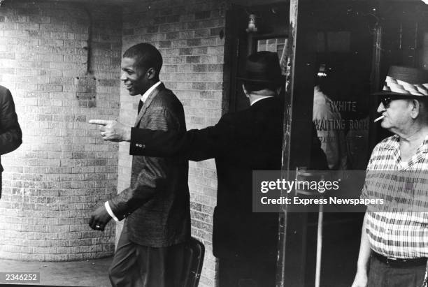 An unidentified young Black 'Freedom Rider' is told to leave a segregated 'white' waiting room at a bus depot in Jackson, Mississippi, May 26, 1961....