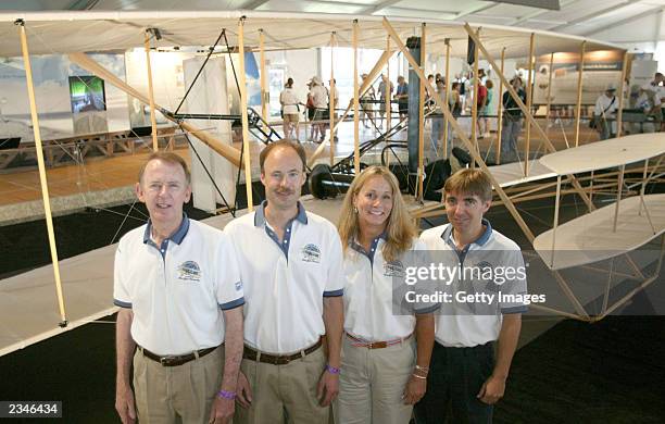 In this image provided by the Experimental Aircraft Association , pilots Ken Hyde, Kevin Kochersberger, Terry Queijo and Chris Johnson stand near a...