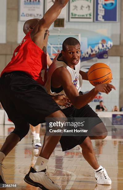 Leandro Barbosa of the Phoenix Suns drives to the basket past Kenny Gregory of the Chicago Bulls during the Rocky Mountain Revue Summer league at...