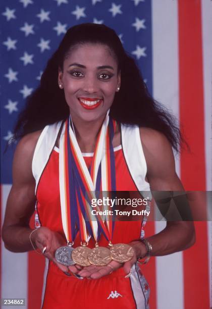 Olympian Florence Griffith-Joyner during a photo shot displaying her three gold medals and one silver on April 26, 1988 that she received at the 1988...