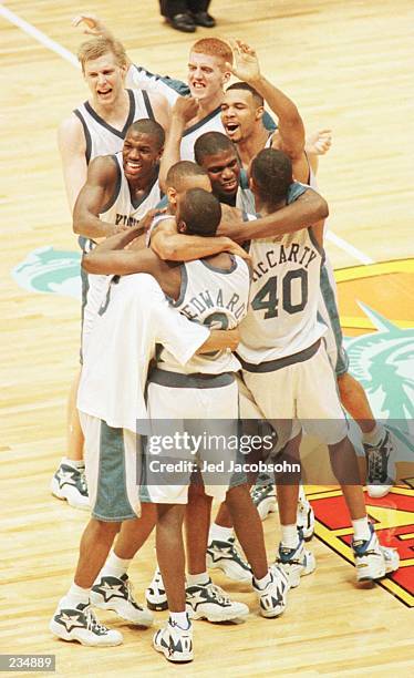 The Kentucky team celebrates after winning the 1996 NCAA Men''s Basketball Championship at the Continental Air Arena in East Rutherford, New Jersey.