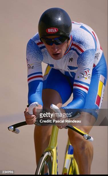 Philippe Gaston Ermenault of France in action in the individual pursuit qualifiers at Stone Mountain Velodrome at the 1996 centennial Olympic games...