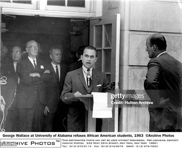 June 11, 1963 -- Tuscaloosa, AL: Governor George Wallace speaks in the doorway of a campus building at the University of Alabama in Tuscaloosa,...