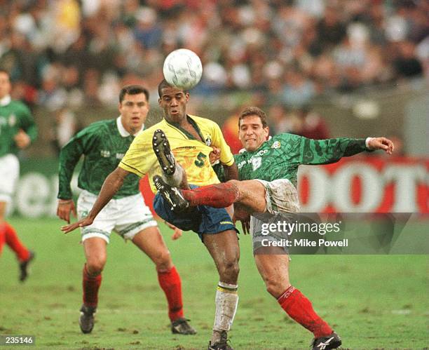 Ricardo Pelaez of Mexico battles with Flavio Conceicao of Brazil for posession of the ball during the Mexico versus Brazil CONCACAF Gold Cup...