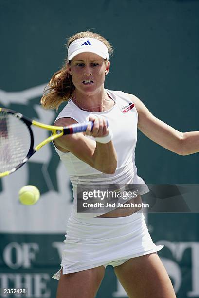 Meghann Shaughnessy of the USA returns a shot against Mikaelian Marie-Gaianeh of Switzerland during the Bank of the West Classic at Stanford...