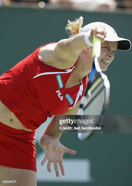 Kim Clijsters of Belgium serves against Marie-Gaianeh Mikaelian of Switzerland during the quaterfinals of the Bank of the West Classic at Stanford...