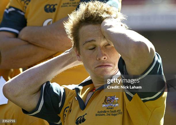 Matt Giteau rubs his head during the Australian Wallabies Captains Run held at Suncorp Stadium August 1, 2003 in Brisbane, Australia.