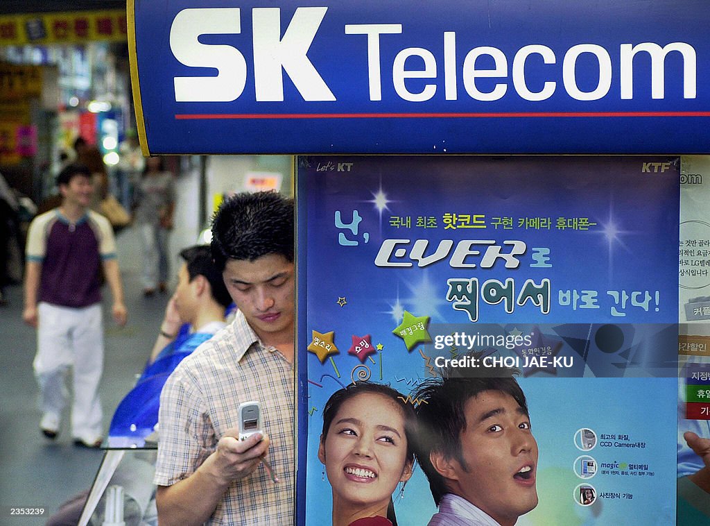 A South Korean man checks his telephone