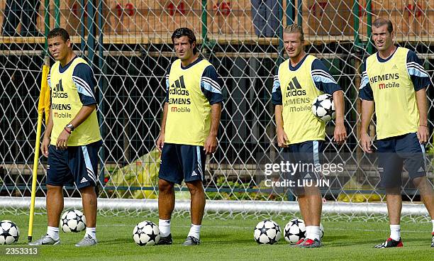 Brazil's Ronaldo, Portugal's Luis Figo, England's David Beckham and France's Zinedine Zidane attend Real Madrid's afternoon practice session at the...