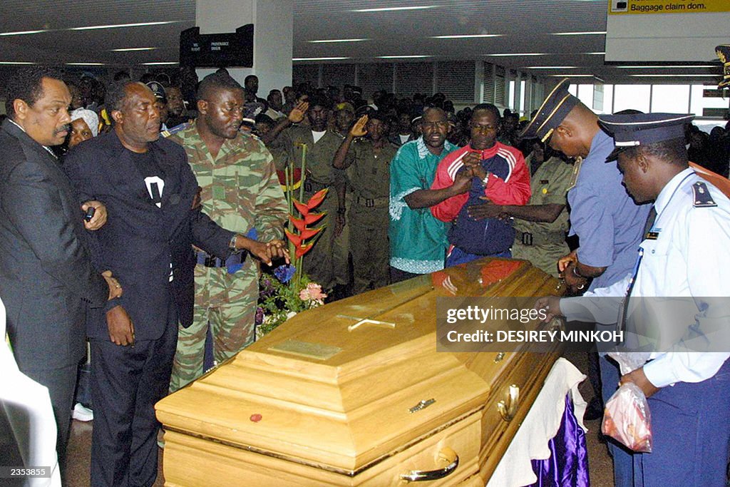 Martin Foe Amougou (2ndL), the father of