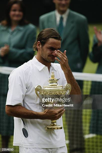 Roger Federer of Switzerland wipes away a tear after his victory over Mark Philippoussis of Australia in the Men's Singles Final during the final day...