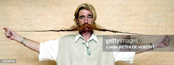 Belgian hairdresser Piet Satter from Merksem, near Antwerp, poses, 10 July 2003, to show off his 1,95-meter-long beard. Satter also displays a...