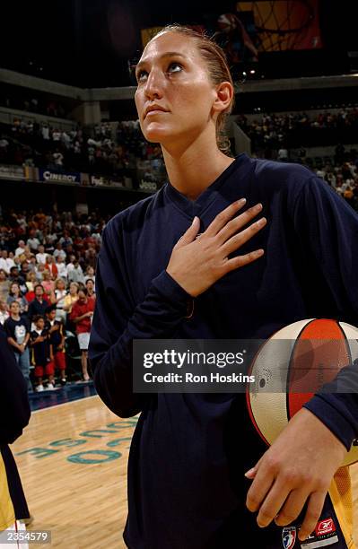 Kelly Schumacher of the Indiana Fever looks on during the National Anthem before the game against the Minnesota Lynx at Conseco Fieldhouse on July...