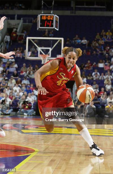 Nykesha Sales of the Phoenix Mercury drives to the basket against the Connecticut Sun during the game at America West Arena on July 19, 2003 in...