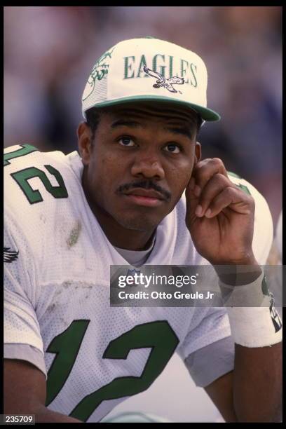 Quarterback Randall Cunningham of the Philadelphia Eagles sits on the bench during the Eagles 48-17 loss to the Oakland Raiders at the Oakland...