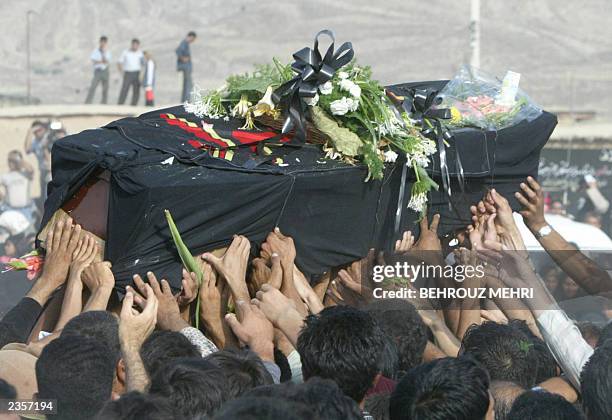 Iranians carry the coffin of Laleh Bijani -- one of the Iranian cojoined twins who died at the age of 29 on the operating table in Singapore in a...