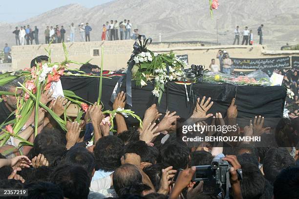 Iranians carry the coffin of Laleh Bijani -- one of the Iranian cojoined twins who died at the age of 29 on the operating table in Singapore in a...