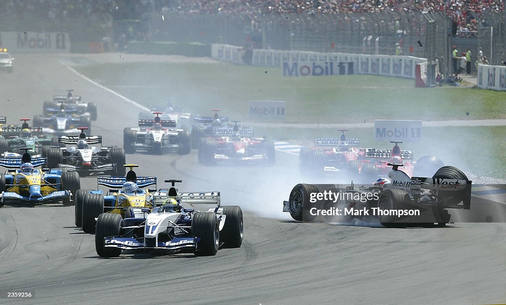 Kimi Raikkonen of Finland and McLaren crashes