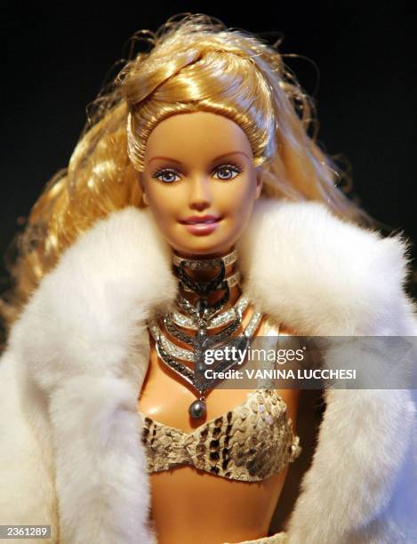 Barbie wears jewels by Grisogono 17 July 2003 during the presentation of the 2003 Barbie Jewelry Collection in Monaco. The jewels will be auctioned...