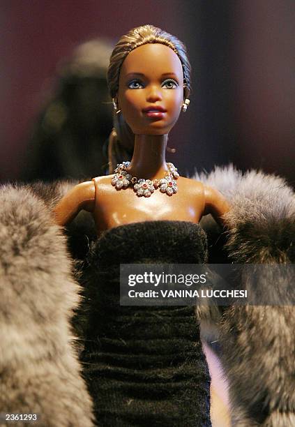 Barbie wears jewels by Buccellati 17 July 2003 during the presentation of the 2003 Barbie Jewelry Collection in Monaco. The jewels will be auctioned...