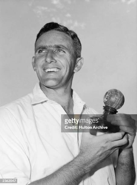 Australian left-handed fast-medium bowler Alan Davidson with a trophy, 1962.