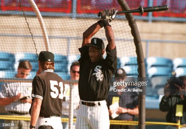 MICHAEL JORDAN LOOSENS UP DURING HIS FIRST DAY OF SPRING TRAINING WITH THE CHICAGO WHITE SOX.