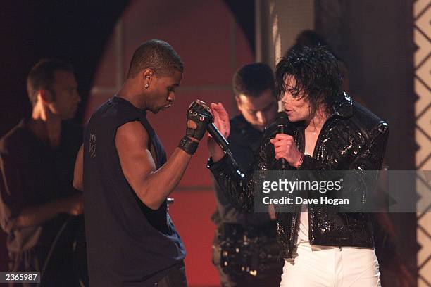 Michael Jackson sings with usher at the Michael Jackson: 30th Anniversary Celebration, The Solo Years at Madison Square Garden in New York City on...