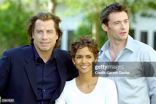 John Travolta, Halle Berry and Hugh Jackman sit for a photo to promote their new movie Swordfish at the Four Seasons Hotel Canary wharf, London....