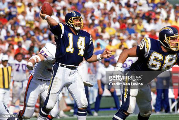 Quarterback Dan Fouts of the San Diego Chargers passes the ball during a game against the Denver Broncos at Jack Murphy Stadium during the 1987 NFL...