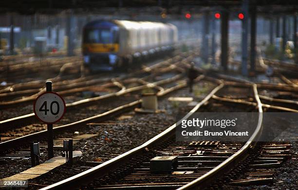 Rail tracks are seen outside of Paddington station August 4, 2003 in London. Due to the risk of the tracks buckling on some lines if the heat reaches...