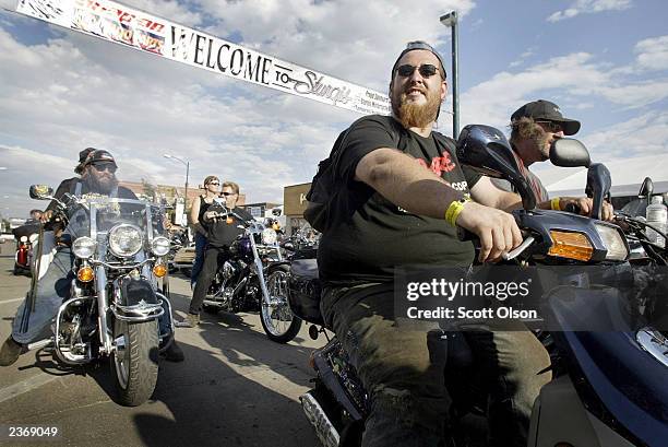 Bikers ride through downtown Sturgis during the start of the annual Sturgis Motorcycle Rally August 4, 2003 in Sturgis, South Dakota. The weeklong...