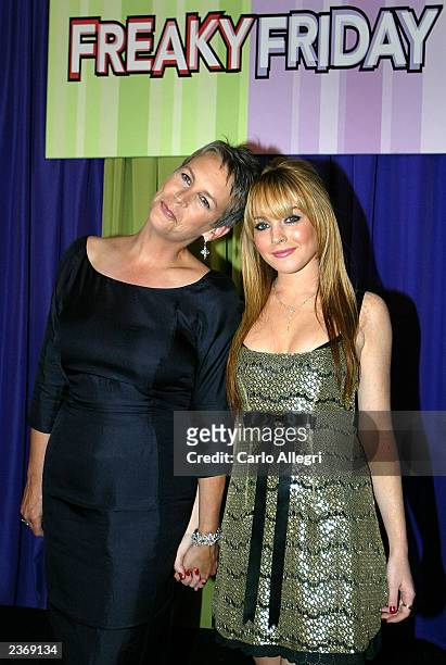 Actress Jamie Lee Curtis and actress Lindsay Lohan , stars of the new Disney film "Freaky Friday," pose as they arrive for the premiere of the movie...